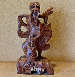 Ancienne statue artisanale pêcheur thaïlandais sculpture sur bois bonne