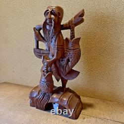 Ancienne statue artisanale pêcheur thaïlandais sculpture sur bois bonne