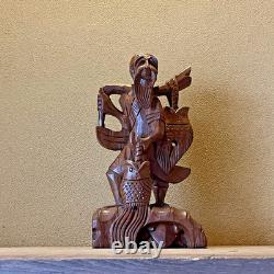 Ancienne statue artisanale pêcheur thaïlandais sculpture sur bois bonne