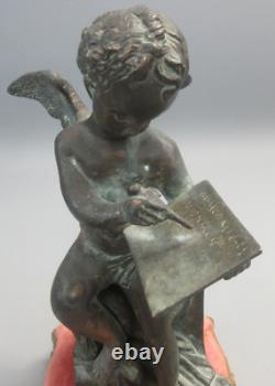 Putti ancien en bronze sur socle en bronze doré et tissu. Hauteur 25,50 cm