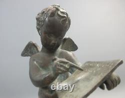 Putti ancien en bronze sur socle en bronze doré et tissu. Hauteur 25,50 cm