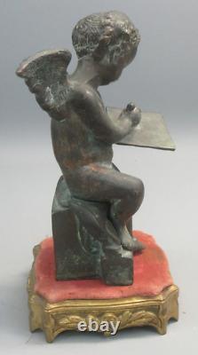 Putti ancien en bronze sur socle en bronze doré et tissu. Hauteur 25,50 cm