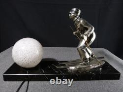 Sculpture statue lampe ancienne art déco régule skieur ski sport d'hivers globe