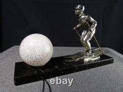 Sculpture statue lampe ancienne art déco régule skieur ski sport d'hivers globe