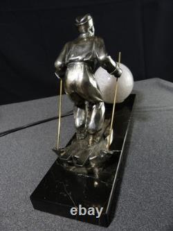 Sculpture statue lampe ancienne art déco régule skieur ski sport d'hivers globe