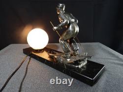 Sculpture statue lampe ancienne art déco régule skieur ski sport d'hivers globe